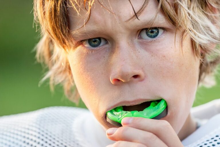 Boy putting in his sports mouth guard
