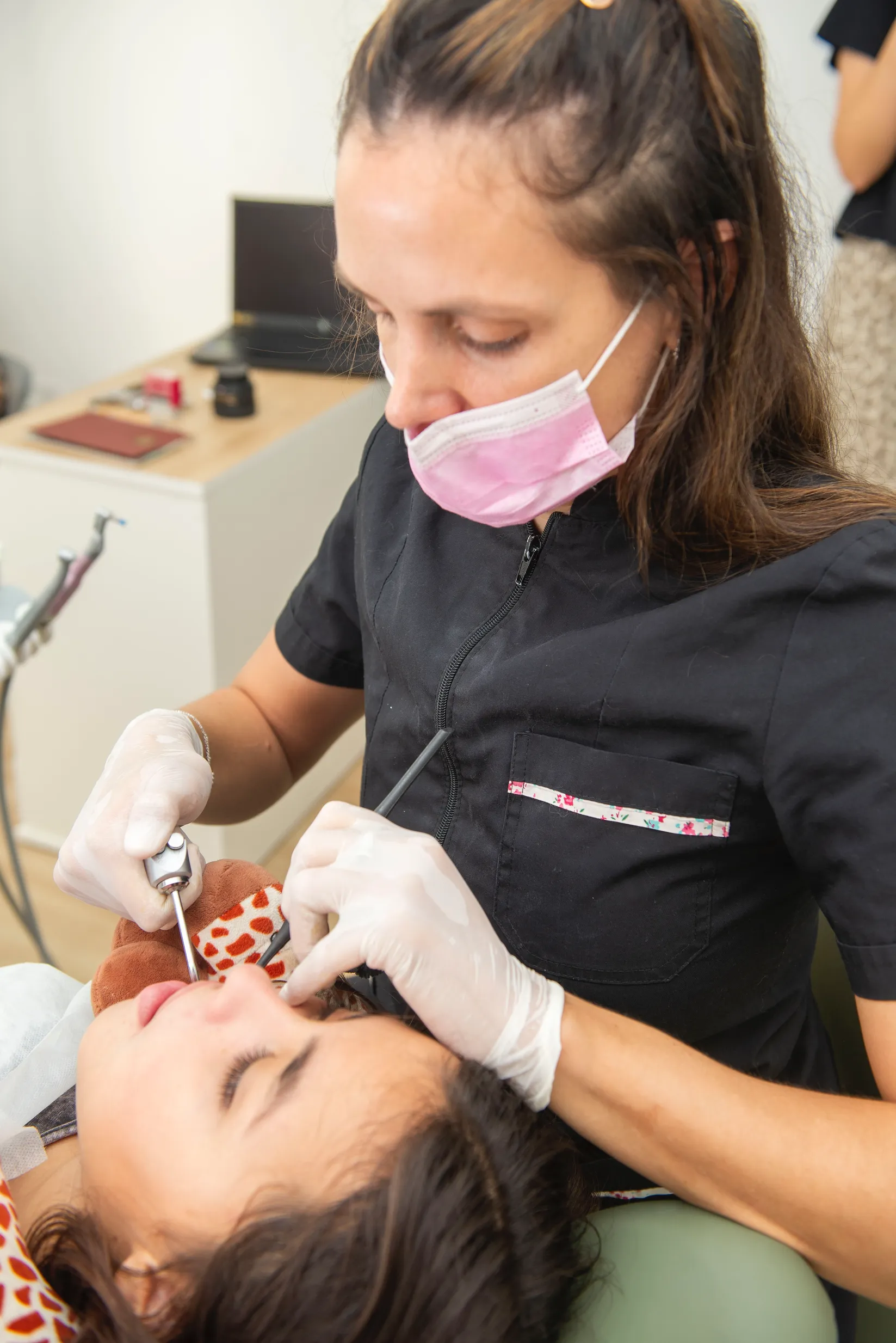 A patient receiving a gentle professional dental cleaning