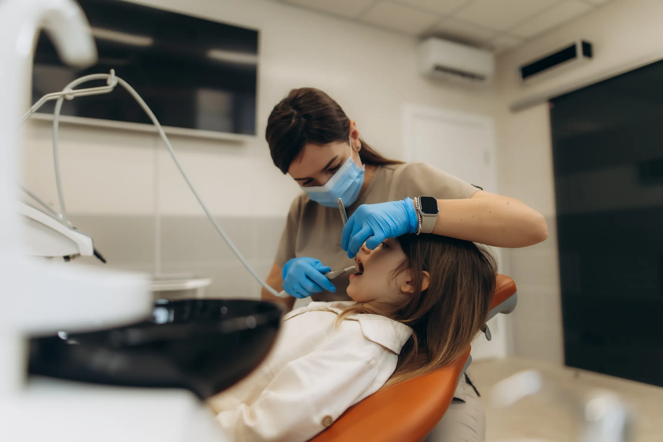 A child smiling happily at a dental visit