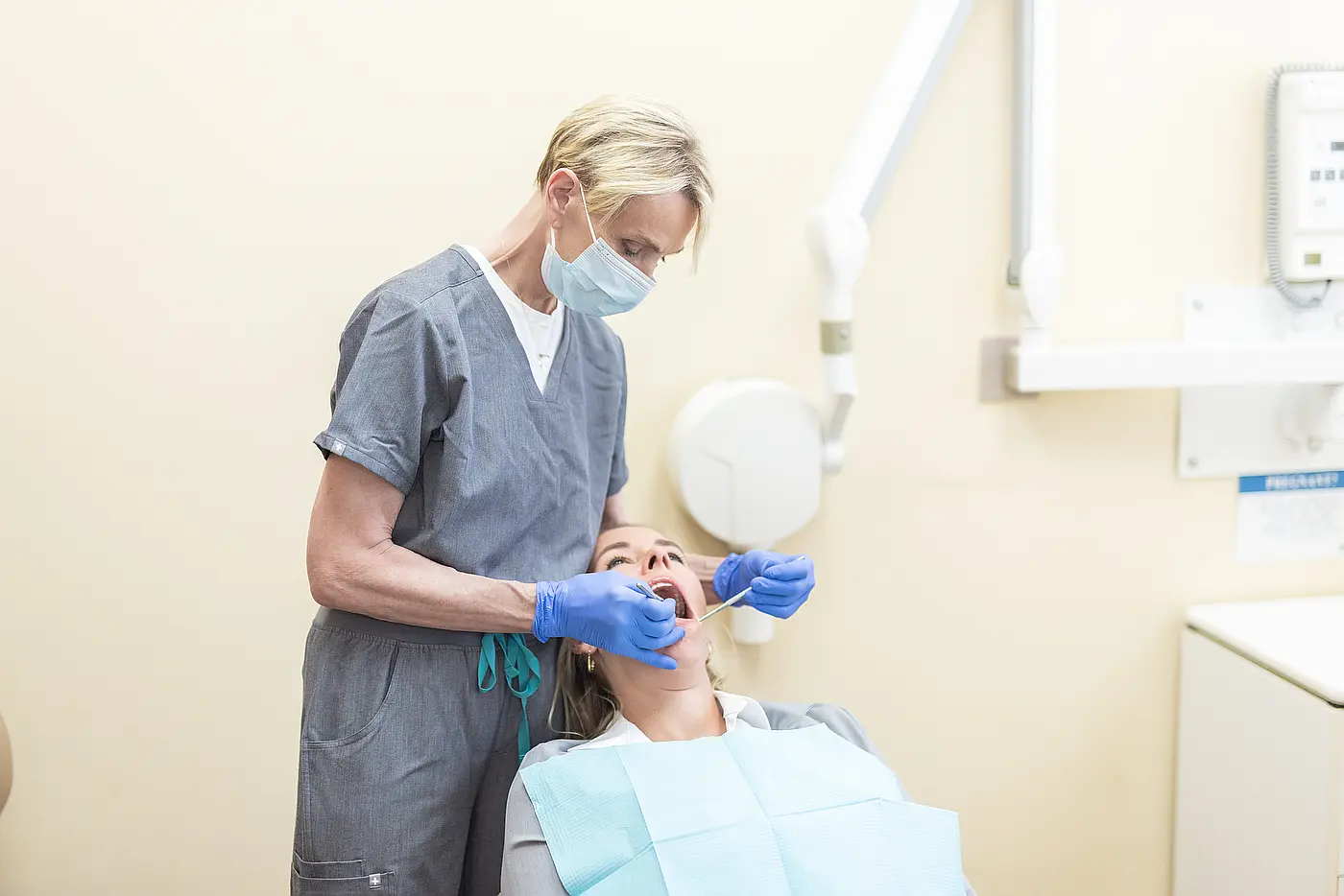 Dr. Eva Hogan cleaning a patient’s teeth
