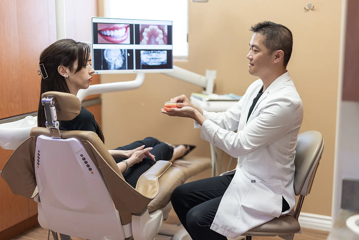 Dr. Eric Wu reviewing 3D digital scans with a patient