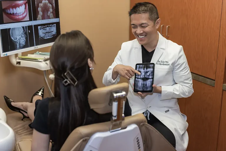 Dr. Eric Wu showing a patient images on a tablet