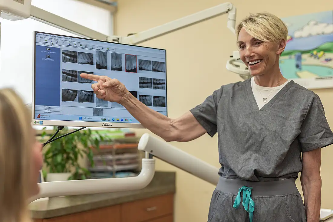 A hygienist providing periodontal maintenance care